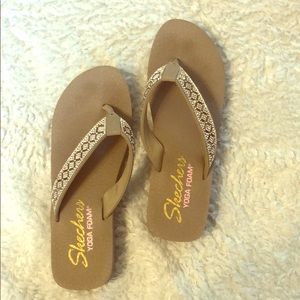 BLING BLING! Skechers Yoga Foam tan flip flops.